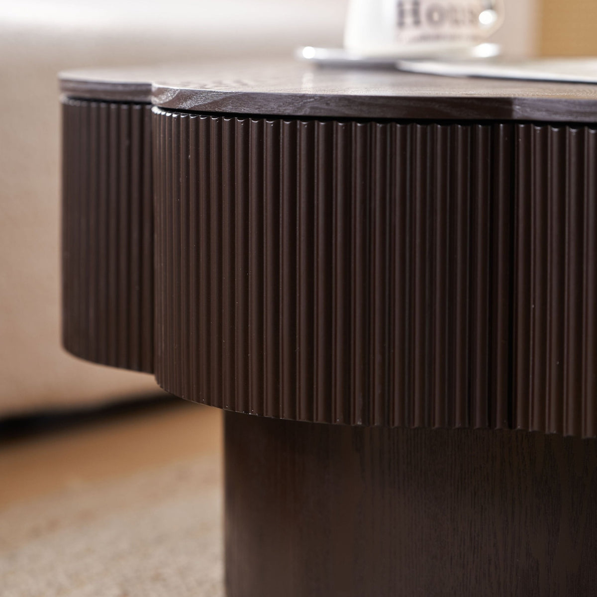 Dark brown wood veneer Plum Blossom coffee table by Anthony & Home with a sleek, modern design in a contemporary living room setting.