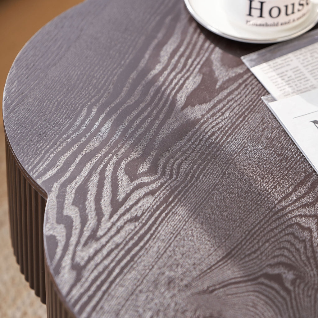 Dark brown wood veneer Plum Blossom coffee table by Anthony & Home with sleek, modern design and smooth surface.