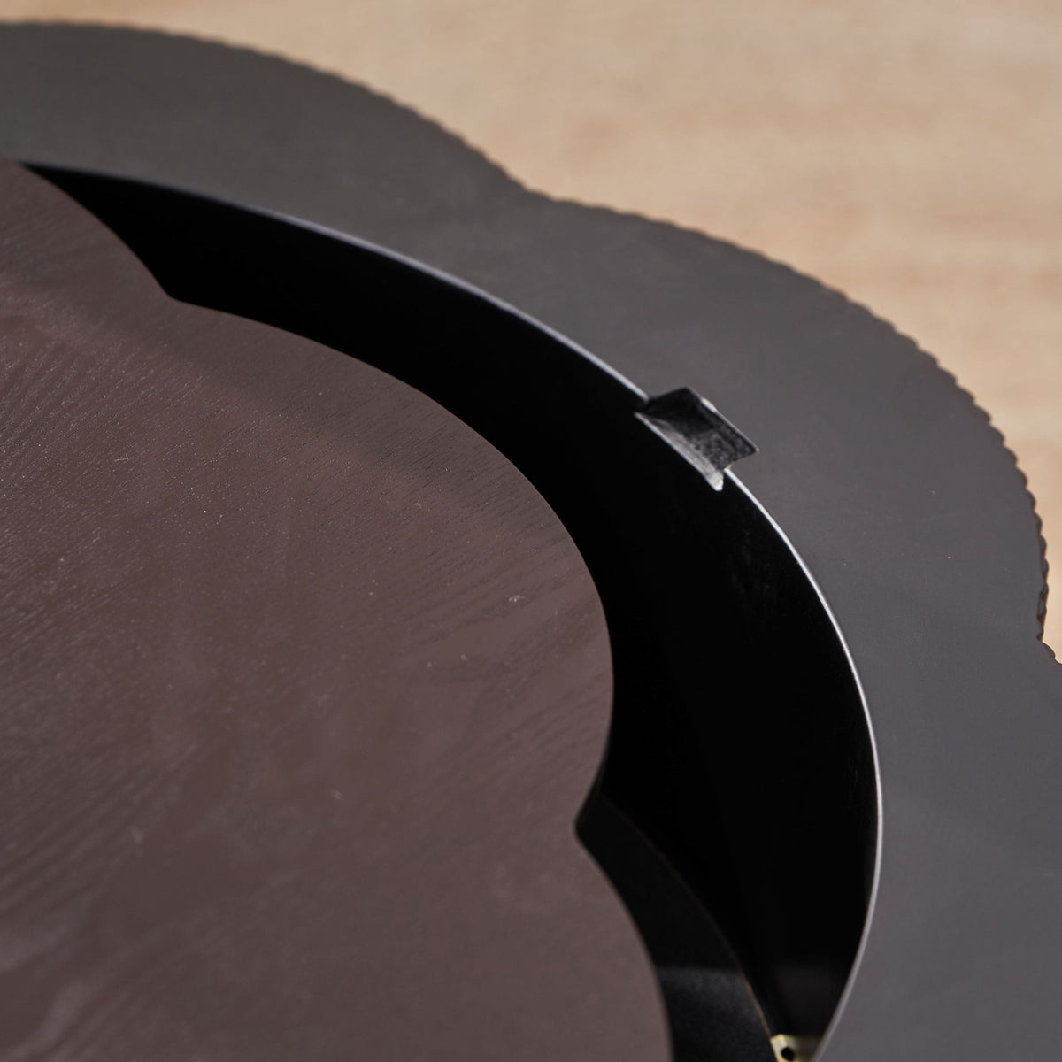Dark brown wood veneer Plum Blossom coffee table by Anthony & Home with a sleek, modern design and a smooth surface.