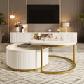 Round nesting coffee table with white gloss top and gold fluted base from Anthony & Home's Signature Collection.