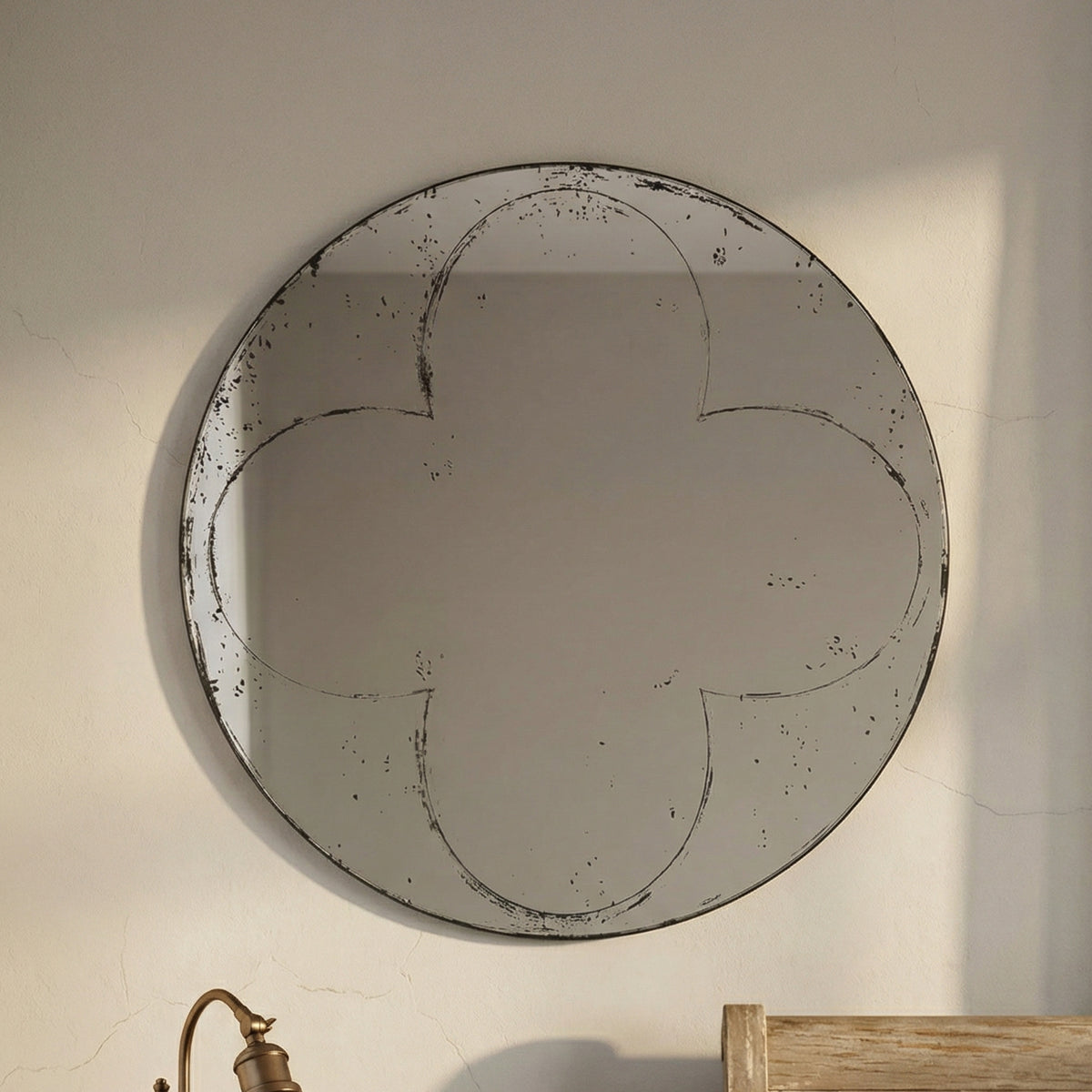 Round wall mirror with brushed brass finish from the Atelier collection by Anthony & Home, showcasing a sleek, modern design.