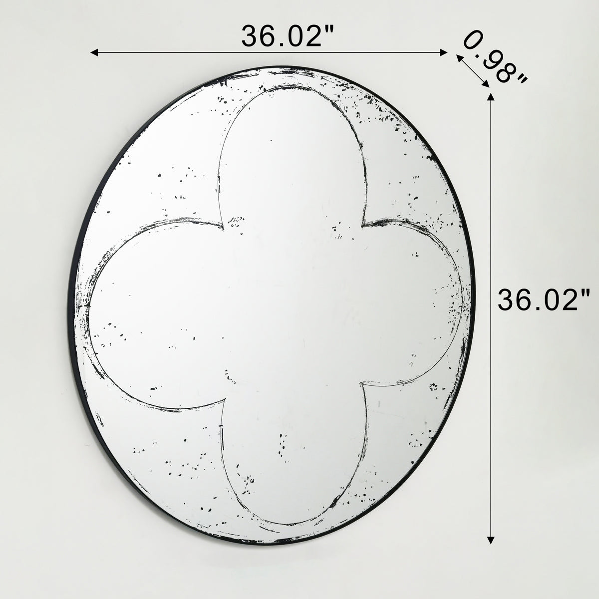 Round wall mirror with brushed brass frame by Anthony & Home, reflecting a modern, stylish interior design element.