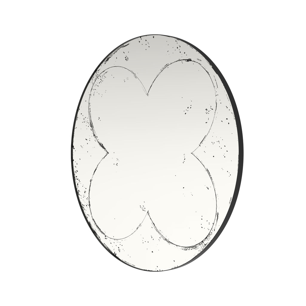 Brushed brass round wall mirror by Anthony & Home with sleek modern frame, hanging on a wall in a contemporary interior setting.