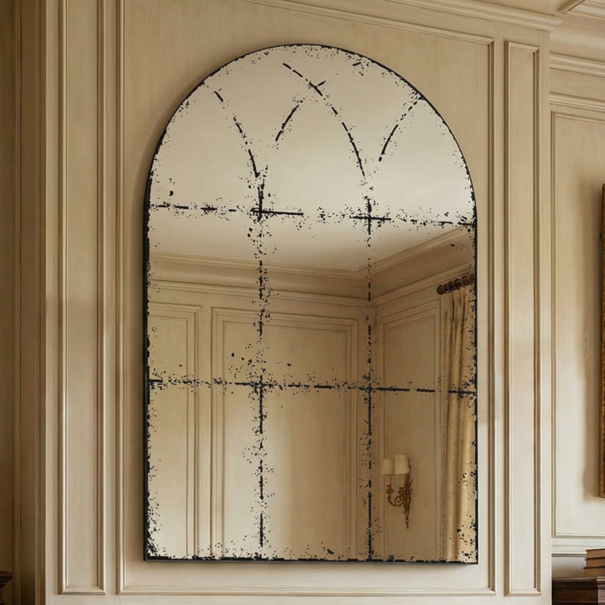 Semicircular wall-mounted mirror with brushed brass finish, suitable for living rooms, by Anthony & Home.
