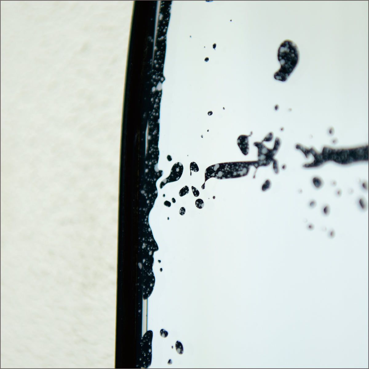 Semicircular wall-mounted mirror with brushed brass finish, ideal for living rooms, by Anthony & Home
