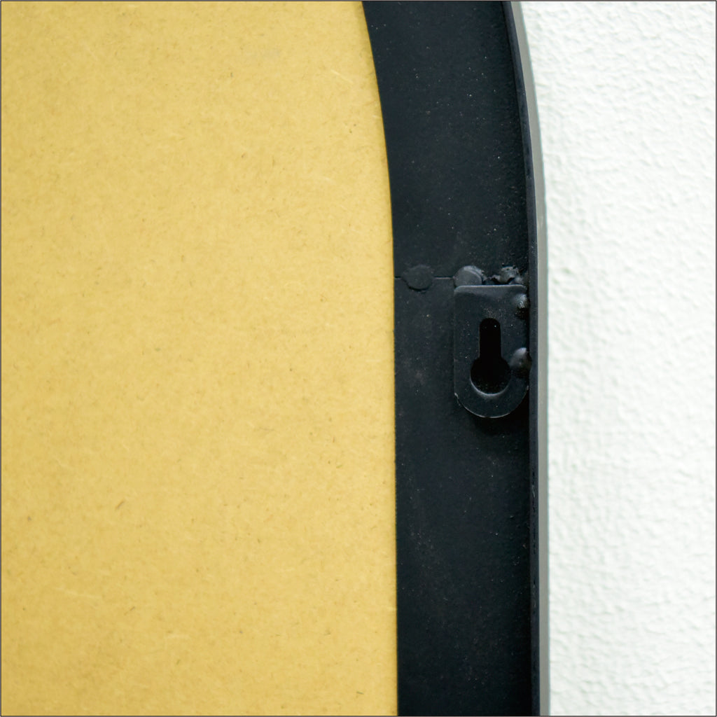 Semicircular wall-mounted mirror with brushed brass finish by Anthony & Home, ideal for living room decor.