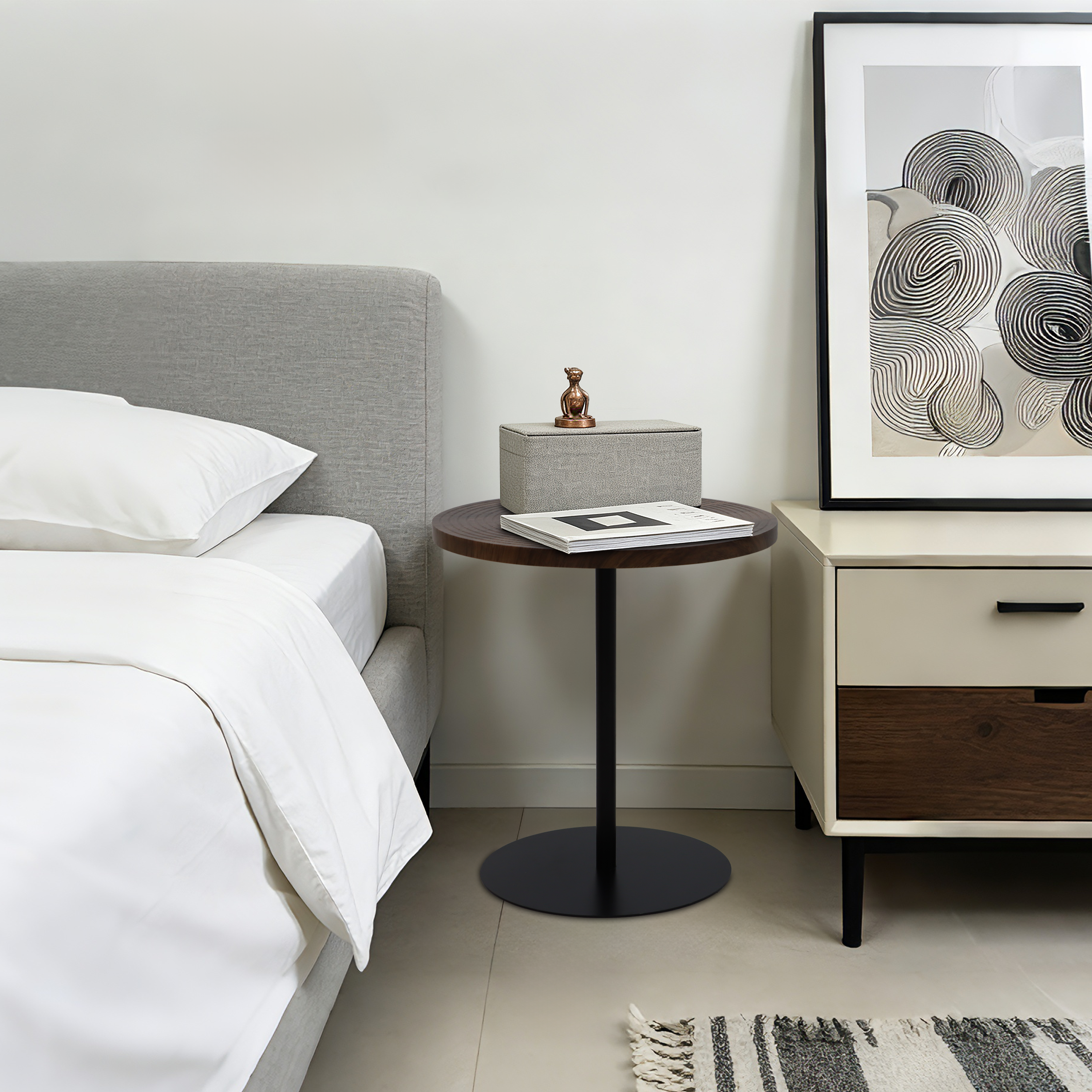 Set of 2 walnut round side tables with black metal pedestal bases featuring a concentric design by Anthony & Home.
