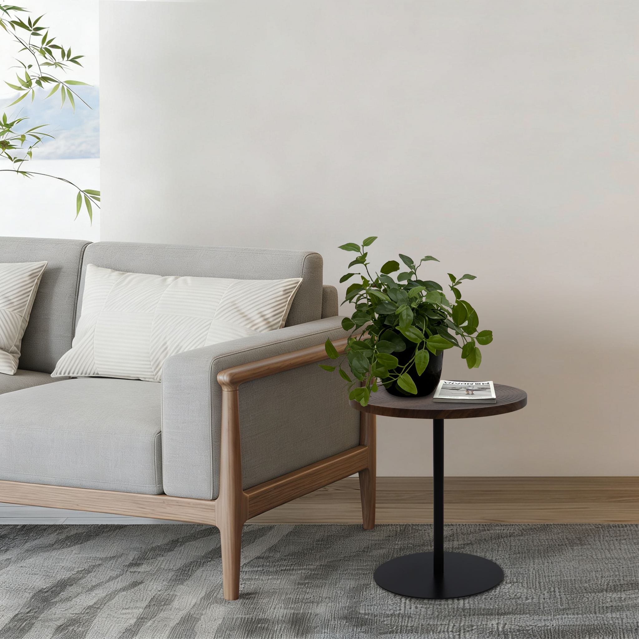 Set of 2 walnut round side tables with black metal pedestal bases featuring concentric design by Anthony & Home.