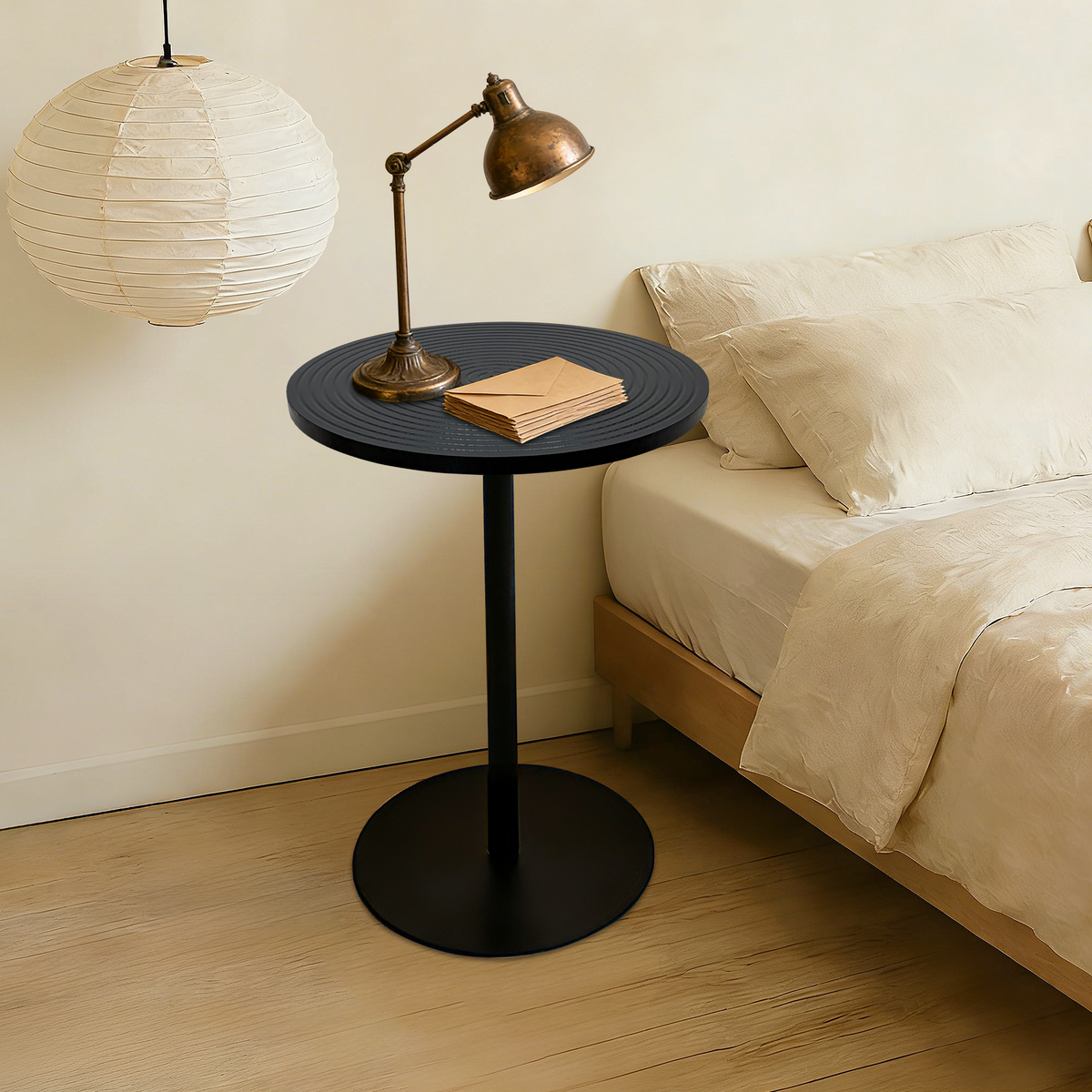 Set of 2 walnut round side tables with black metal pedestal bases featuring concentric design by Anthony & Home.