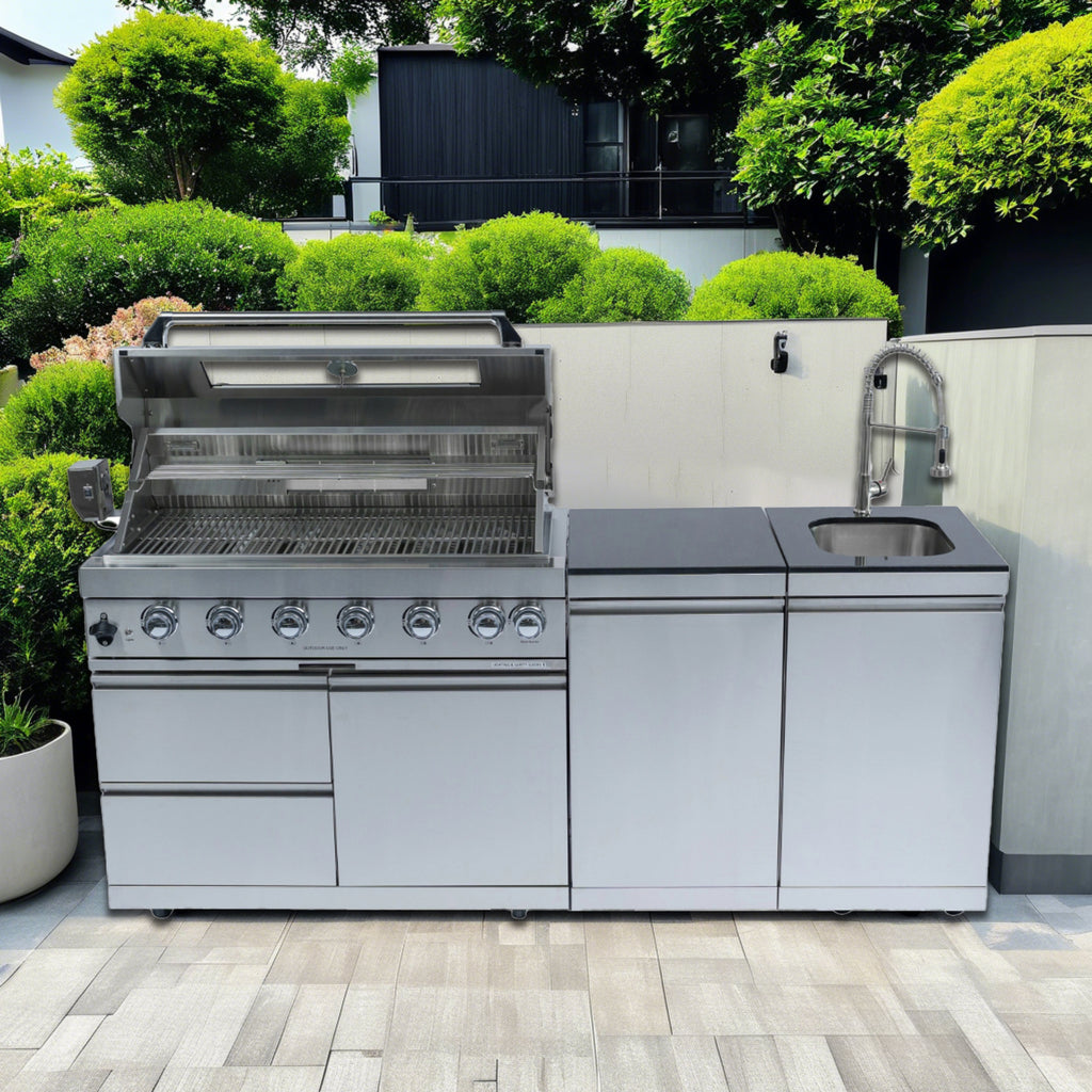 Anthony & Home Signature 43-Inch gas outdoor kitchen island with granite countertop and built-in appliances for backyard cooking.