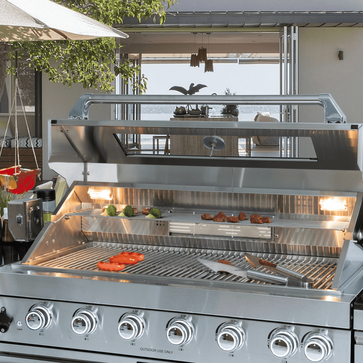 Anthony & Home Signature 43-inch gas outdoor kitchen island with granite countertop, showcasing a functional outdoor cooking space.