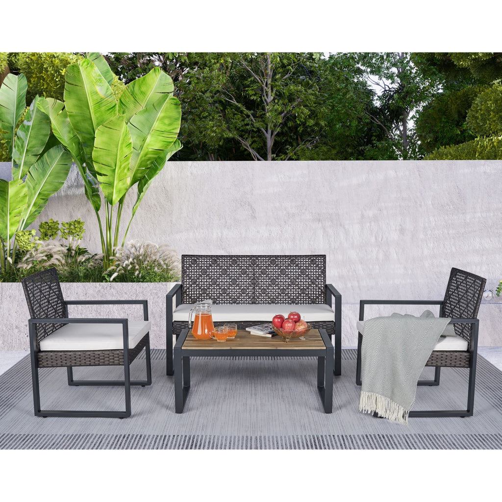 Anthony & Home Signature Acacia wood outdoor patio set with beige cushions, including table and chairs for outdoor relaxation.