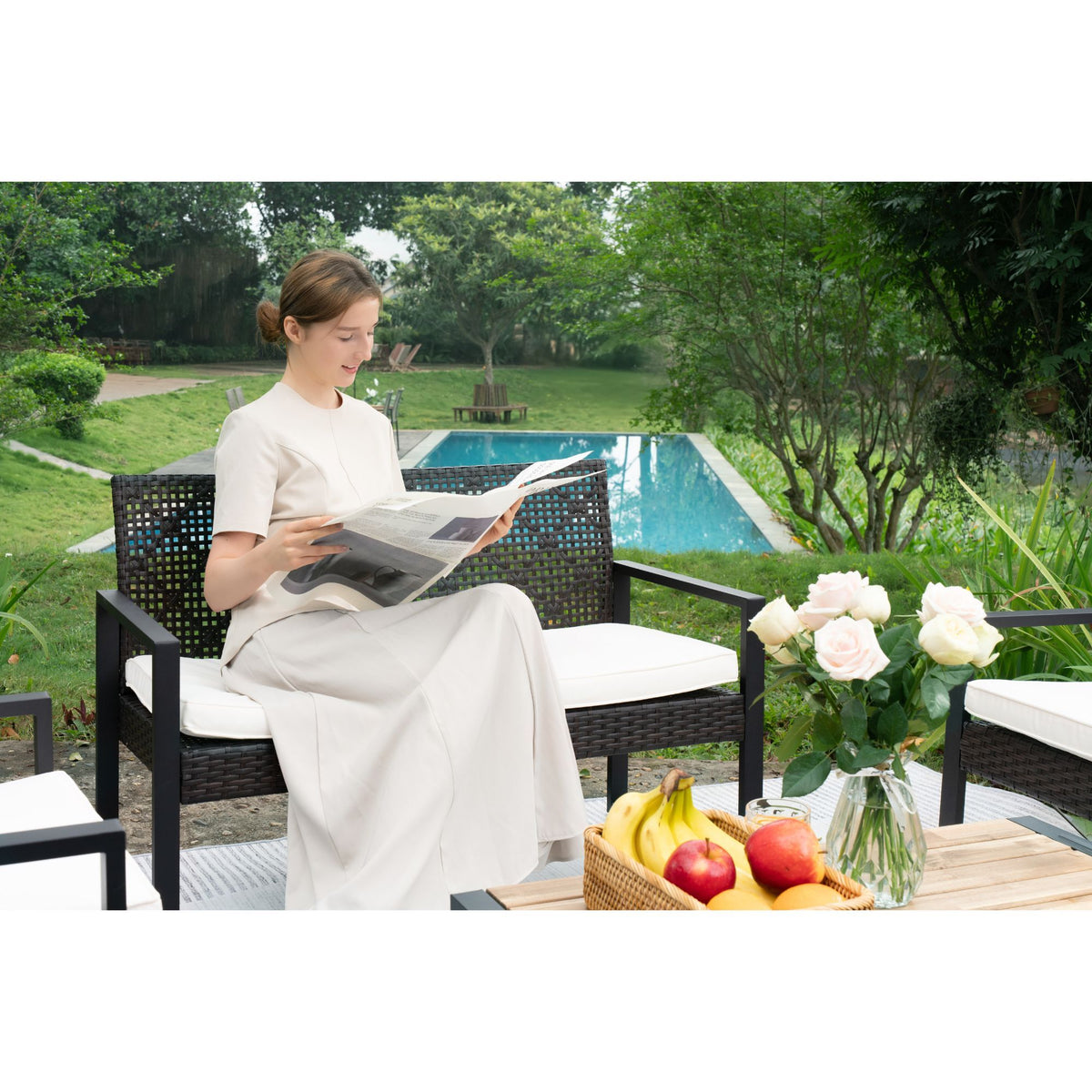 Anthony & Home signature acacia wood outdoor patio set with beige cushions, including table and chairs on a patio.