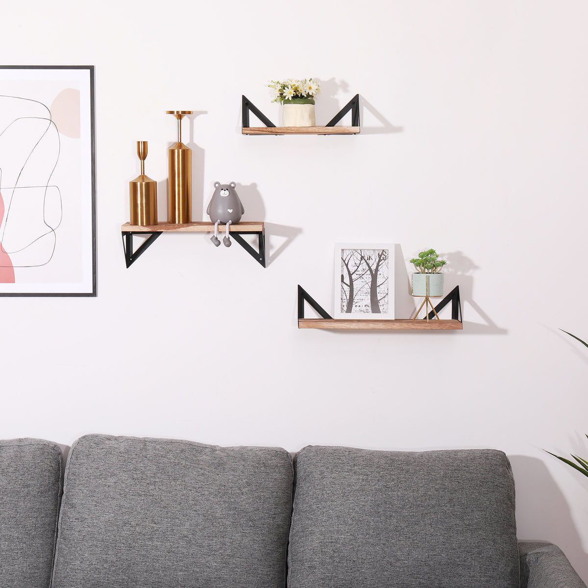 Set of three Anthony & Home Signature Collection natural wood floating shelves for wall display and organization.
