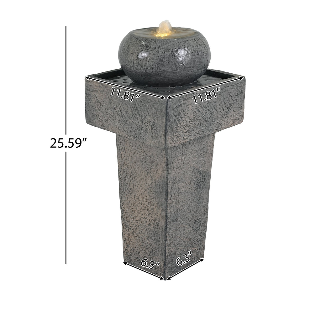 Anthony & Home Signature Concrete Column Fountain with integrated lighting, showcasing a modern outdoor water feature with illumination.
