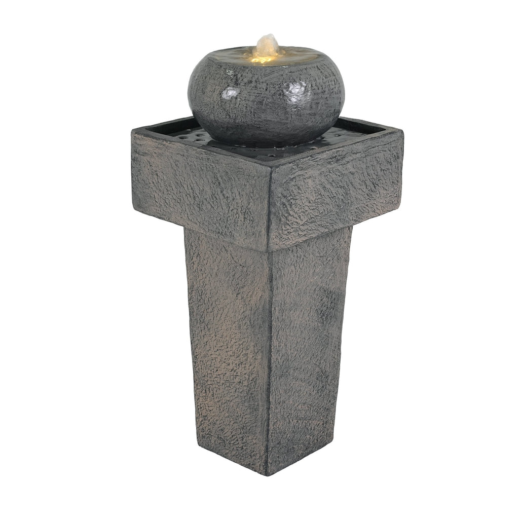 Anthony & Home Signature Concrete Column Fountain with integrated lighting, showcasing a tall, textured concrete water feature with illumination.