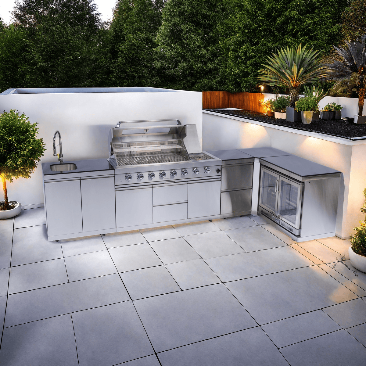 Anthony & Home Signature stainless steel outdoor kitchen island with built-in gas grill and prep surfaces.