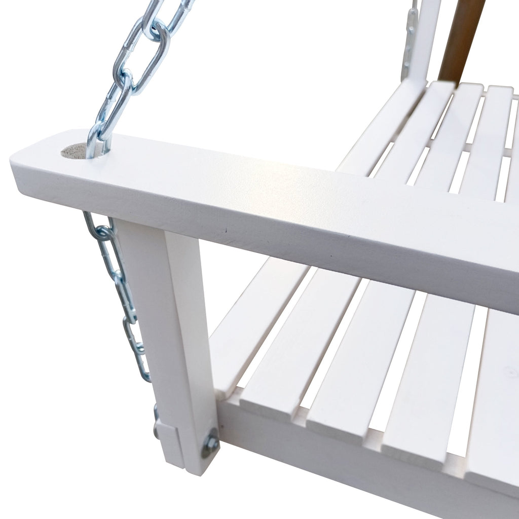 Anthony & Home Signature White Finish Fir Wood Porch Swing hanging on a patio with cushions and greenery in the background.