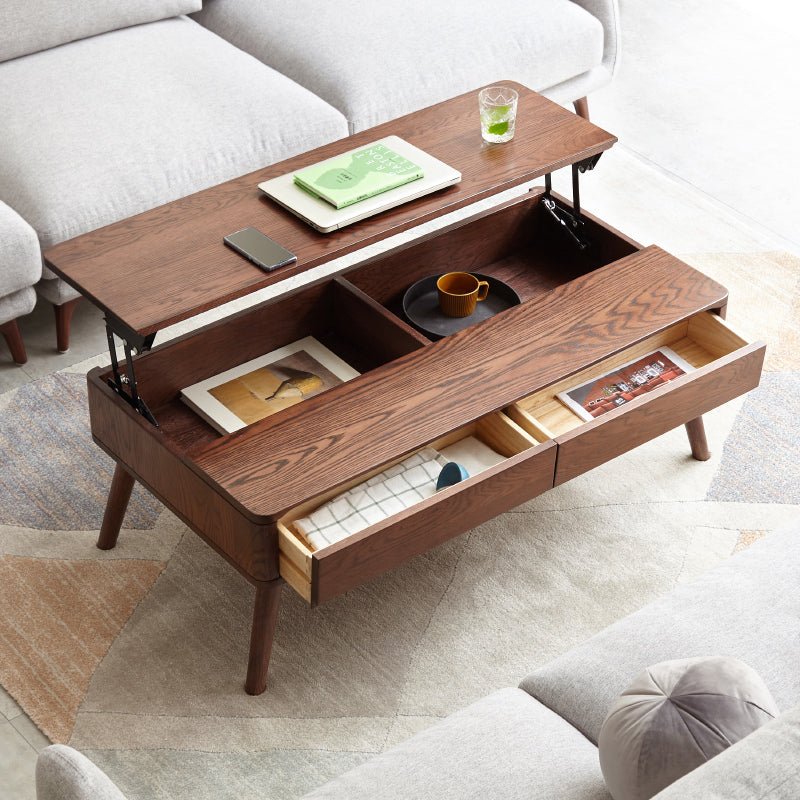 Solid oak center table with lift-top and hidden storage shelf from Anthony & Home's Atelier Collection, featuring a timeless design.
