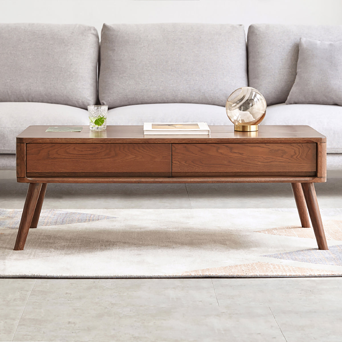 Solid oak center table with lift-top design and hidden storage shelf from Anthony & Home's Atelier Collection.