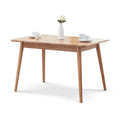 Solid oak extendable dining table by Anthony & Home with a sleek, natural finish and adjustable length for versatile dining space.