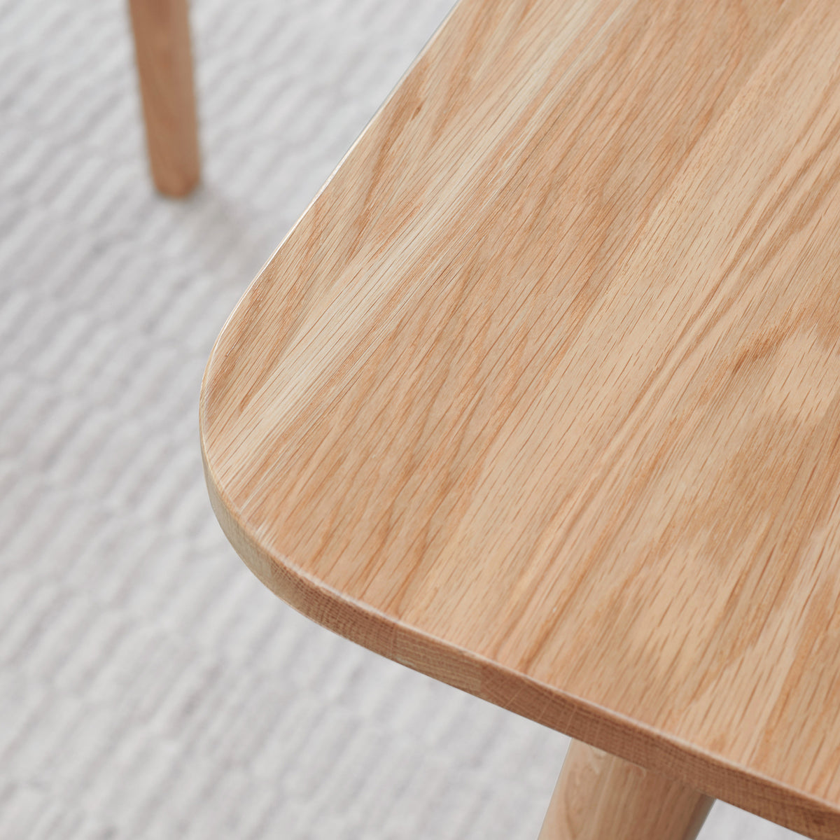 Solid oak extendable dining table by Anthony & Home, showing the natural wood grain and extendable leaves for flexible dining space.