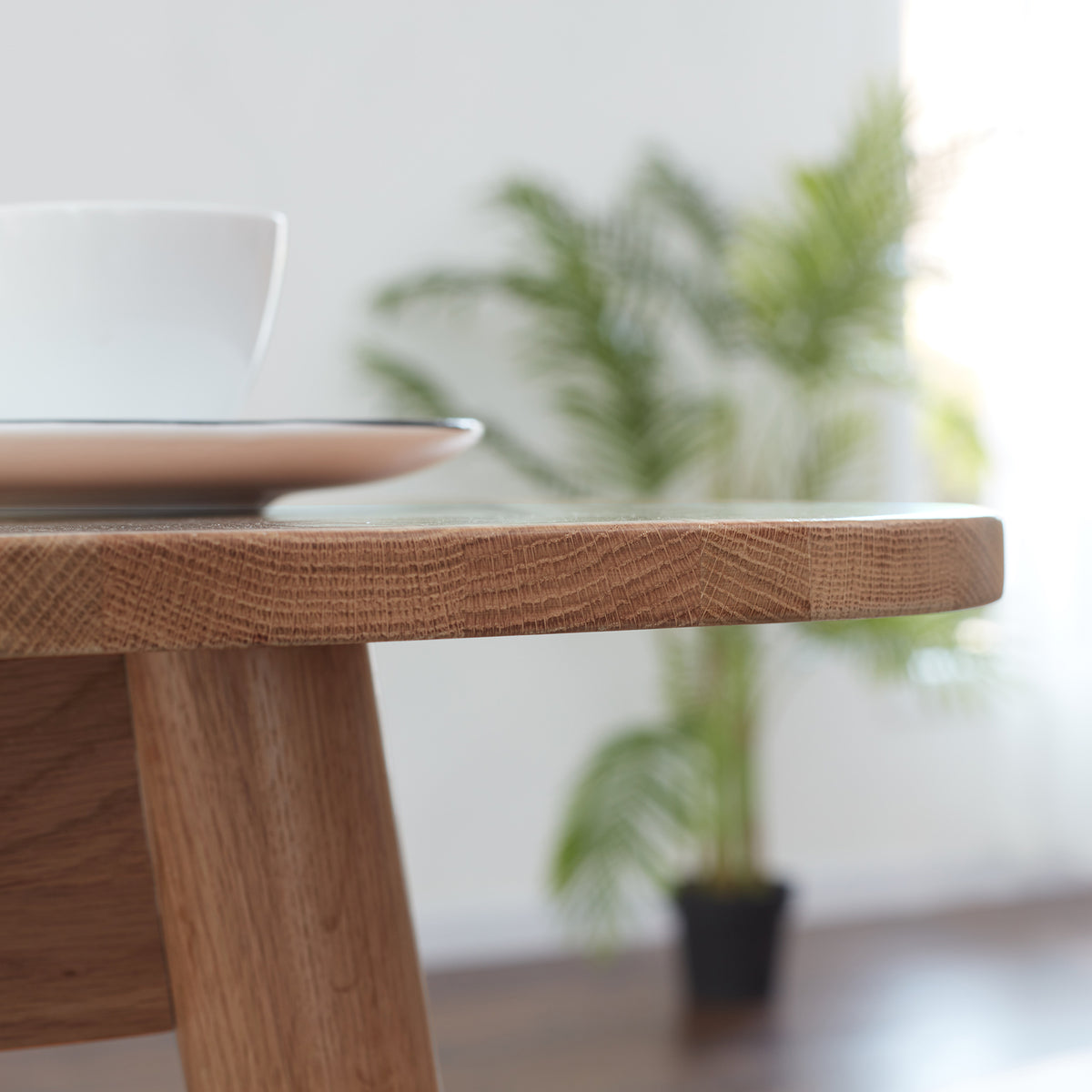 Solid oak extendable dining table by Anthony & Home with a natural wood finish, showcasing its sleek, modern design and extendable feature.