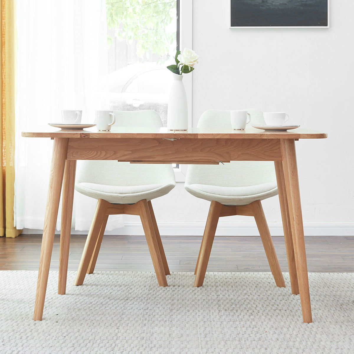 Solid oak extendable dining table by Anthony & Home, showcasing a natural wood finish and sleek modern design
