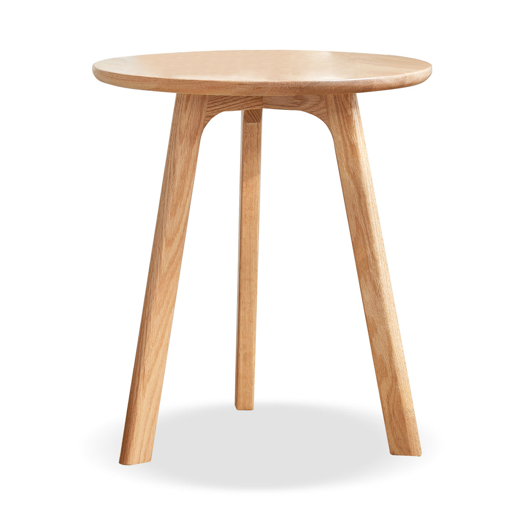 Solid oak round end table from Anthony & Home Signature Collection, featuring a smooth wooden surface and sturdy legs.