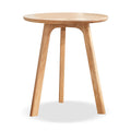 Solid oak round end table from Anthony & Home Signature Collection, featuring a smooth wooden surface and sturdy legs.