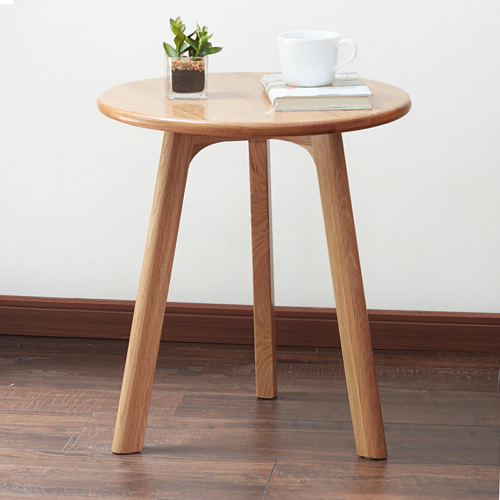 Solid oak round end table from Anthony & Home Signature Collection with a smooth wooden surface and sturdy base.