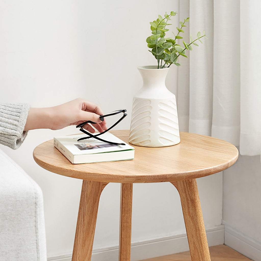 Solid oak round end table from Anthony & Home Signature Collection, featuring a smooth, natural wood finish with sturdy craftsmanship.