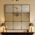 Square wall mirror from Anthony & Home's Atelier Collection with a sleek frame, hanging on a modern interior wall.