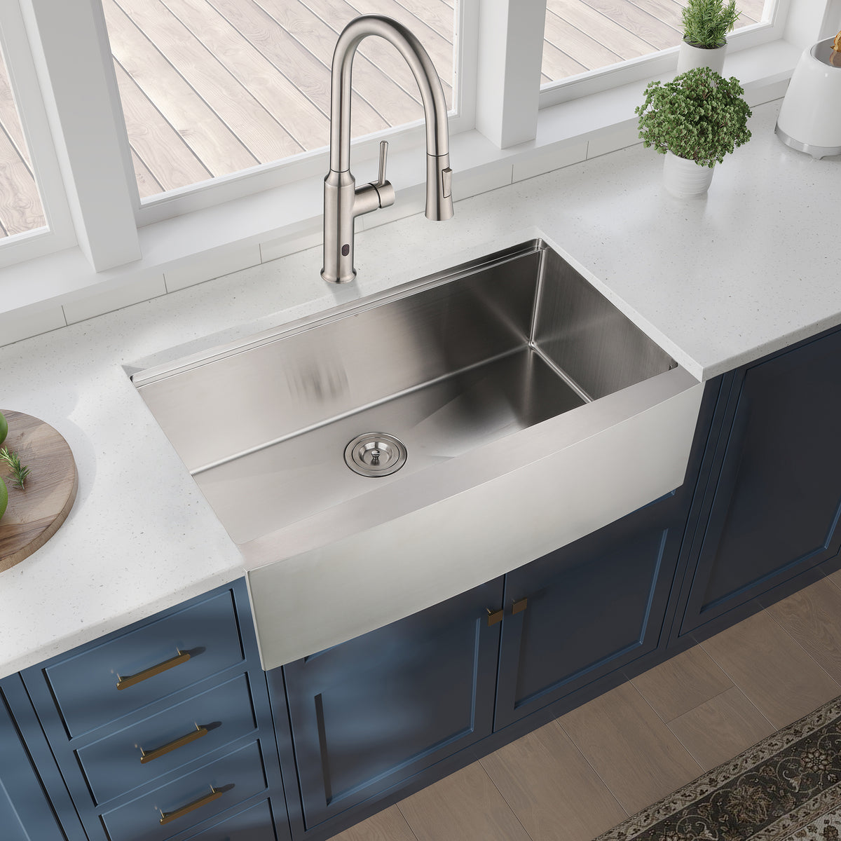 Stainless steel farmhouse apron kitchen sink workstation with deep basin and sleek design, perfect for modern kitchens.