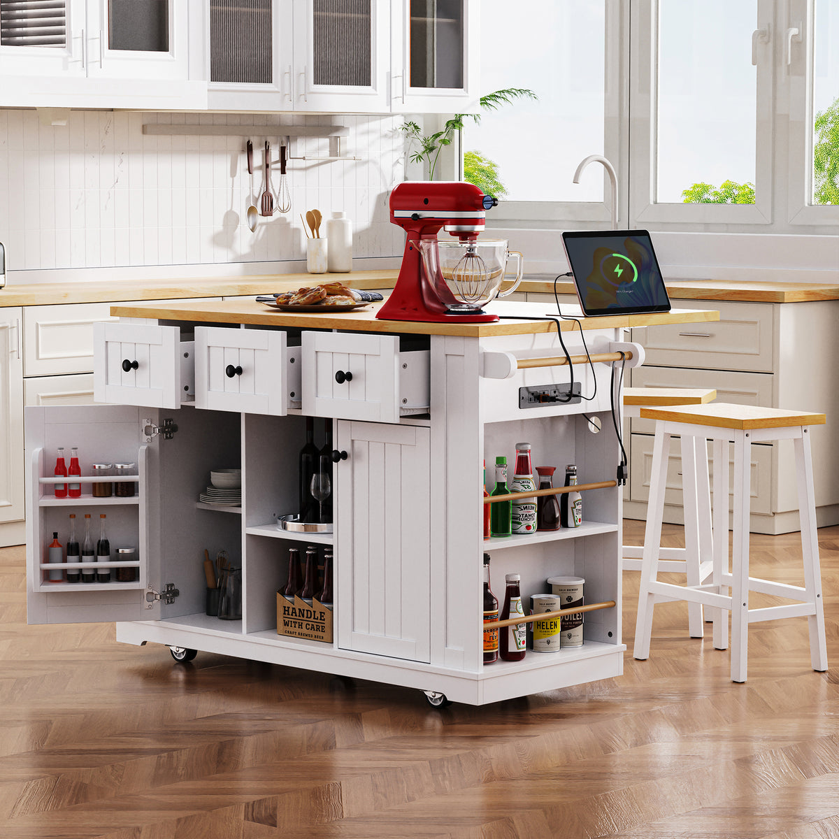 White Anthony & Home Studio MDF kitchen island with drop leaf, bar stools, power outlet, and storage cart.