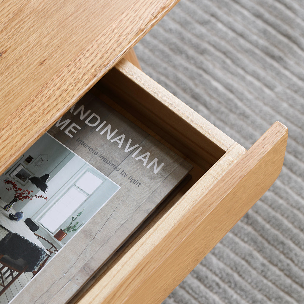 Studio solid oak center table with storage drawers by Anthony & Home, featuring a sleek wooden surface and practical drawers.