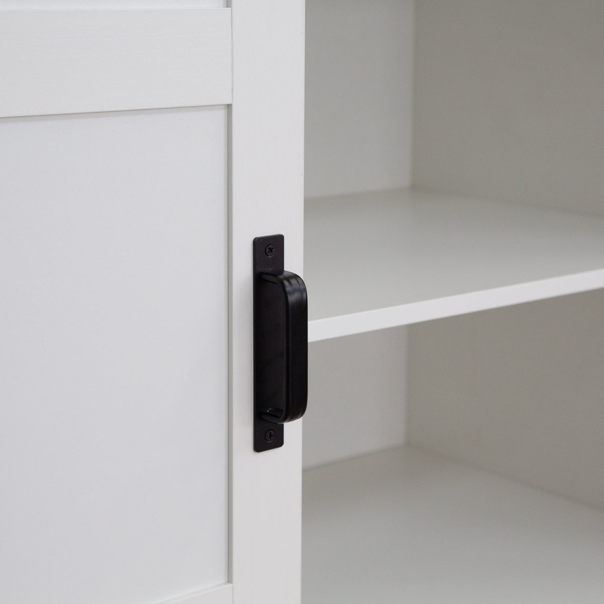 Tall Anthony & Home armoire with sliding barn door, featuring wood finish and spacious interior storage.