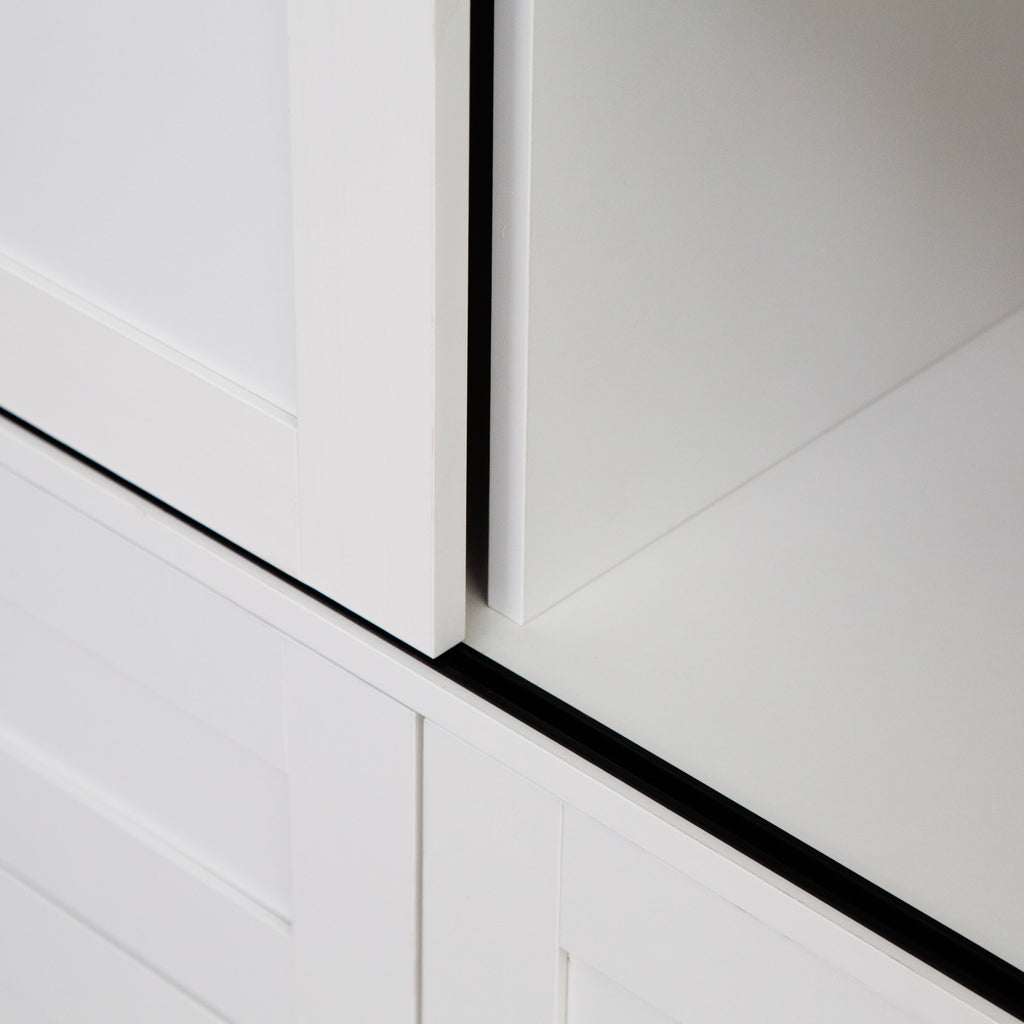 Tall Anthony & Home armoire with barn door featuring wood finish and sleek hardware for stylish storage in bedroom or living space.