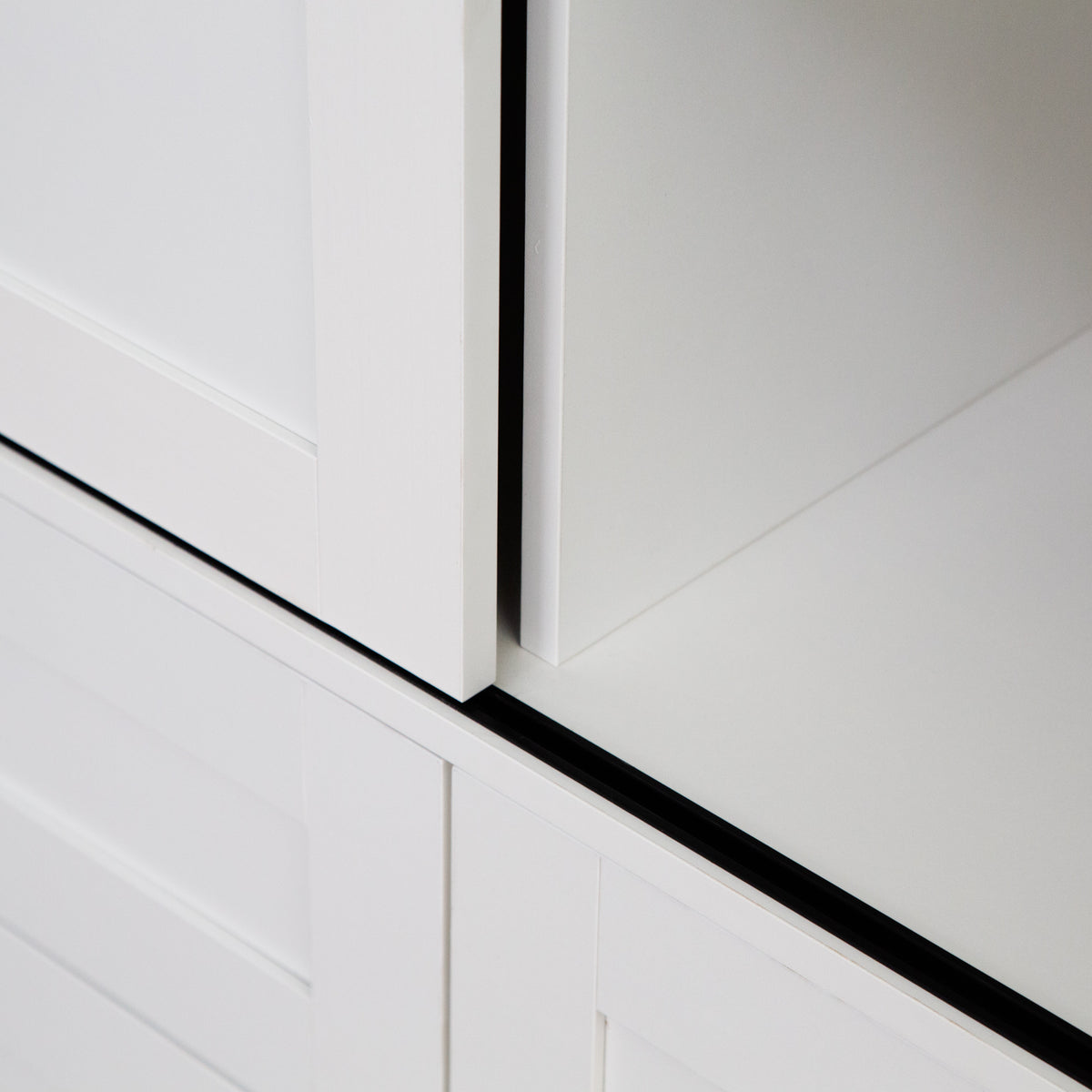Tall Anthony & Home armoire with barn door featuring wood finish and sleek hardware for stylish storage in bedroom or living space.