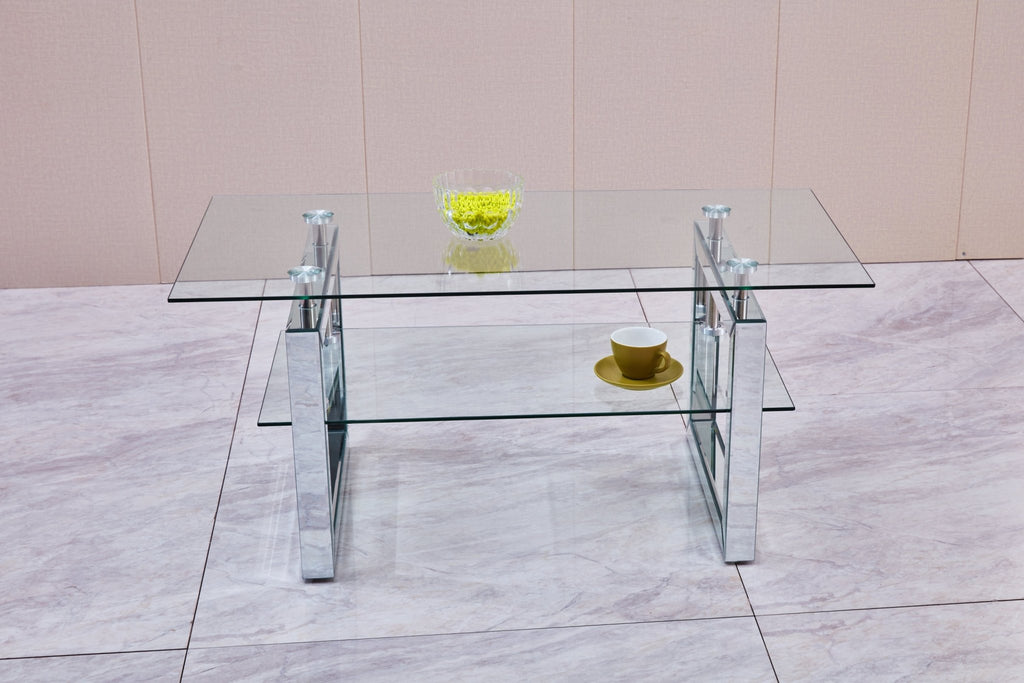 Tempered glass coffee table with a silver-finish metal pedestal base from Anthony & Home's exclusive collection.