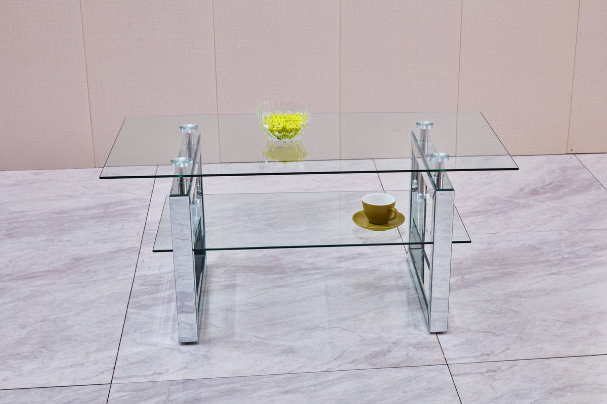 Tempered glass coffee table with a silver-finish metal pedestal base from Anthony & Home's exclusive collection.
