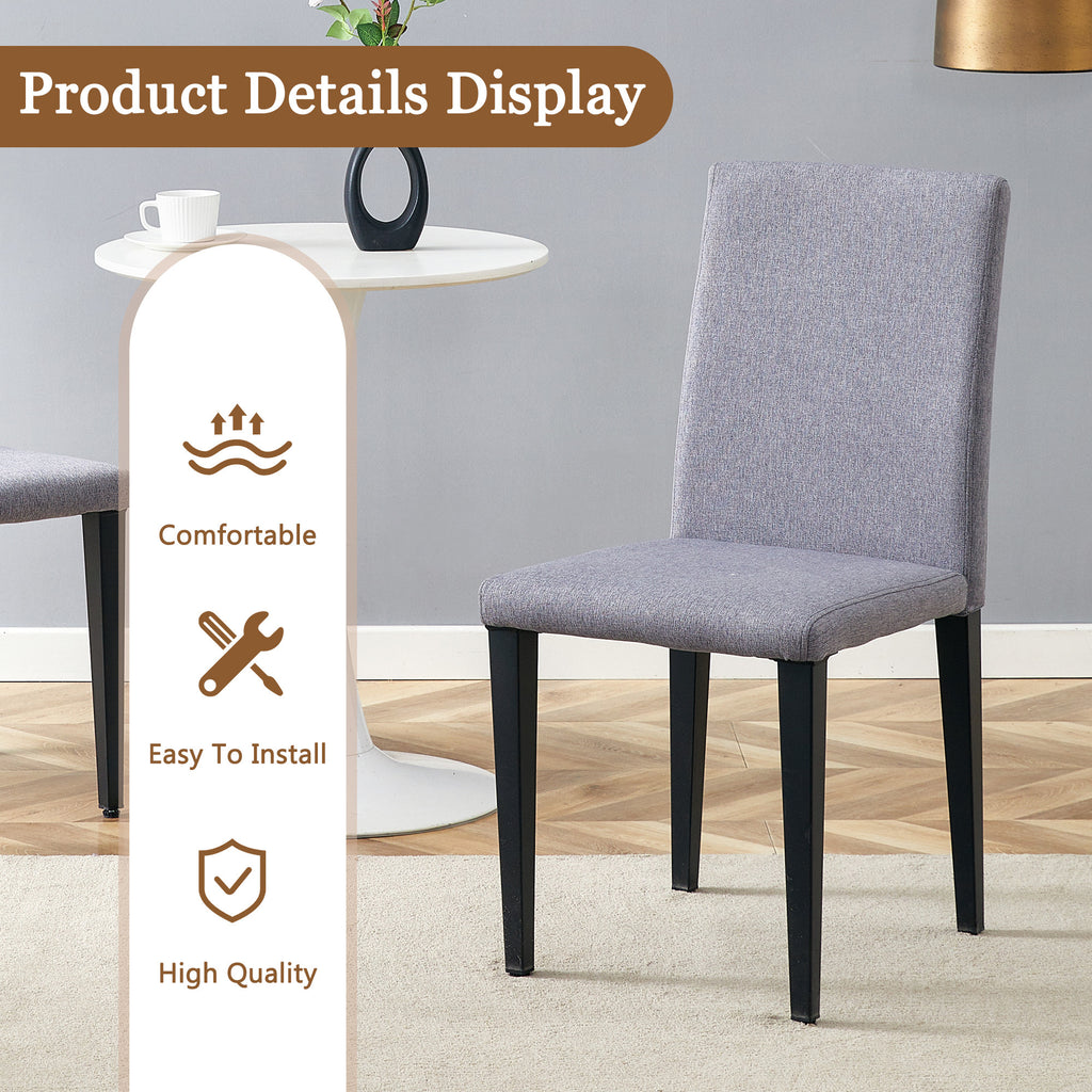 Anthony & Home tempered glass dining table with matching chairs in a modern studio setting.