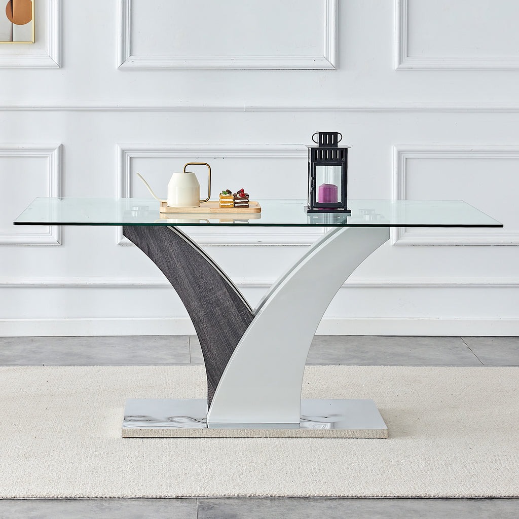 Tempered glass dining table with MDF legs from Anthony & Home Studio Collection, showcasing sleek modern design.
