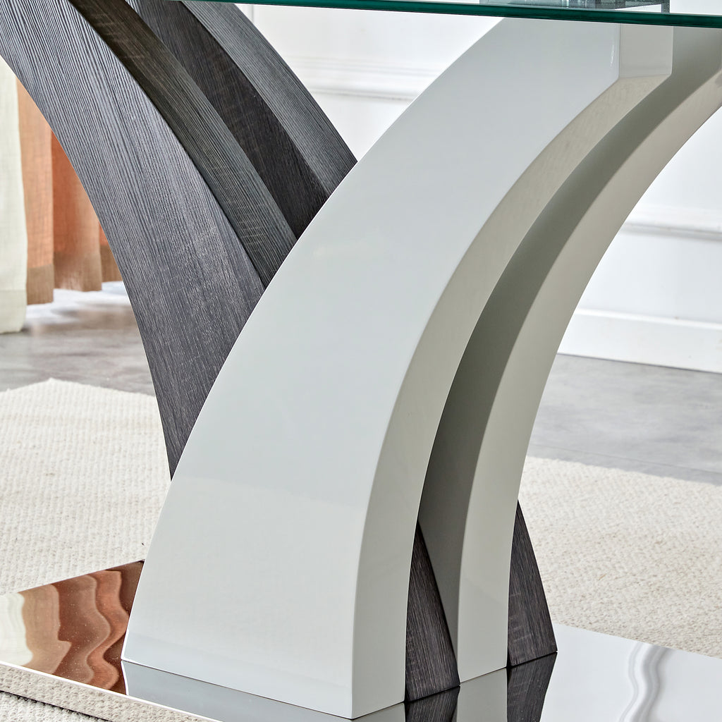 Tempered glass dining table with MDF legs from Anthony & Home Studio Collection, modern design with clear glass surface.