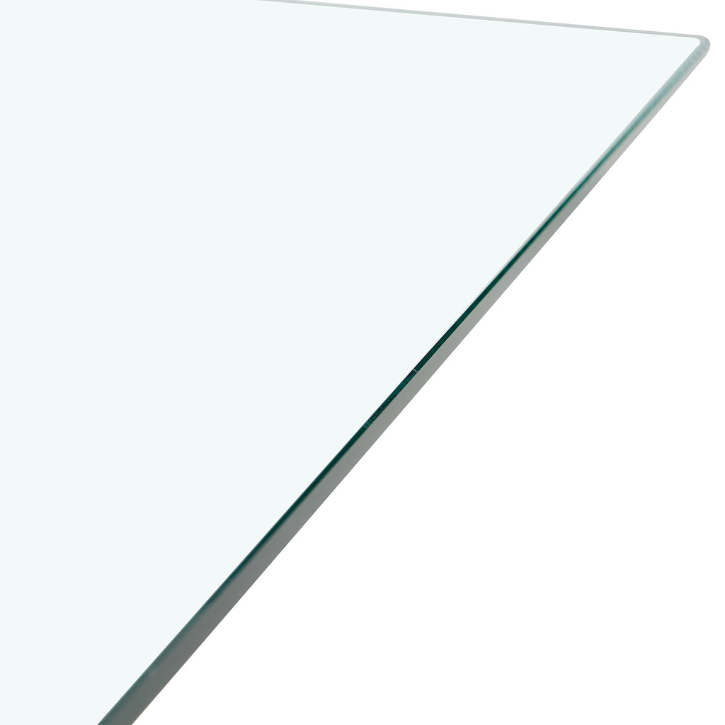 Tempered glass dining table with MDF legs from Anthony & Home's Studio Collection, showcasing a modern, sleek design.