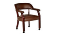 Dark brown fabric traditional arm chair with casters and beaded pedestal from Anthony & Home's Atelier Collection.