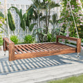 Twin size acacia wood porch swing bed with hemp ropes, natural finish, from Anthony & Home Atelier Collection, hanging outdoors.