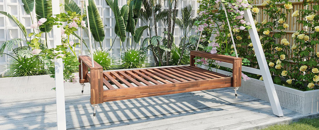 Twin size acacia wood porch swing bed with hemp ropes, natural finish from Anthony & Home Atelier Collection, shown hanging outdoors.