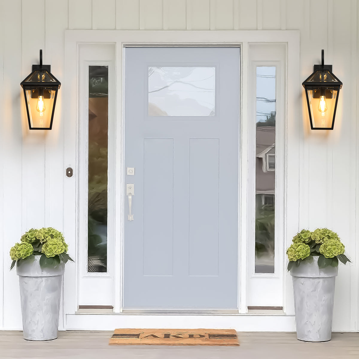 Two matte black outdoor wall lanterns by Anthony & Home featuring classic die-cast metal design for exterior lighting.