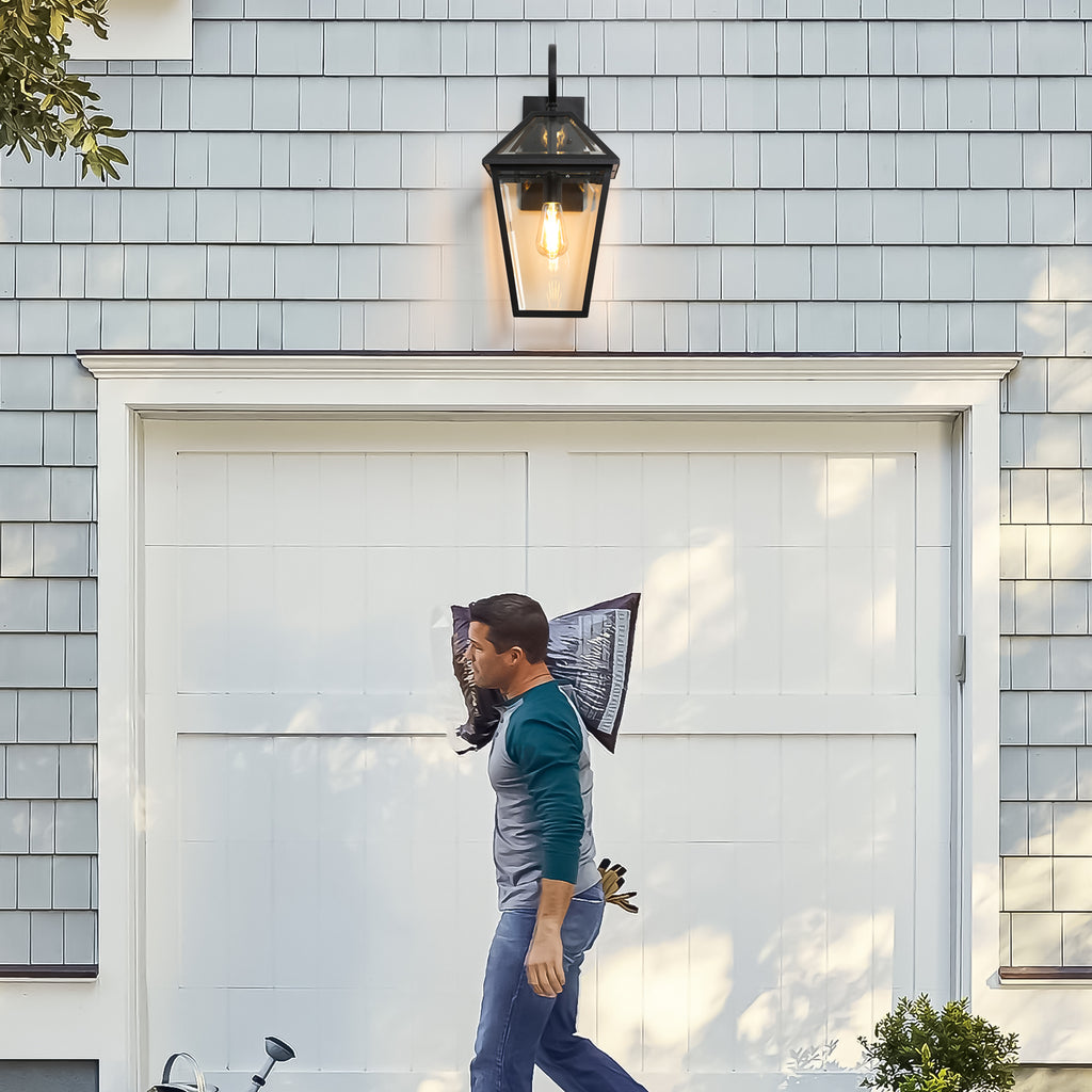 Two-pack outdoor wall lanterns by Anthony & Home in matte black die-cast finish mounted on exterior wall.